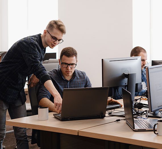 people working in office on computers