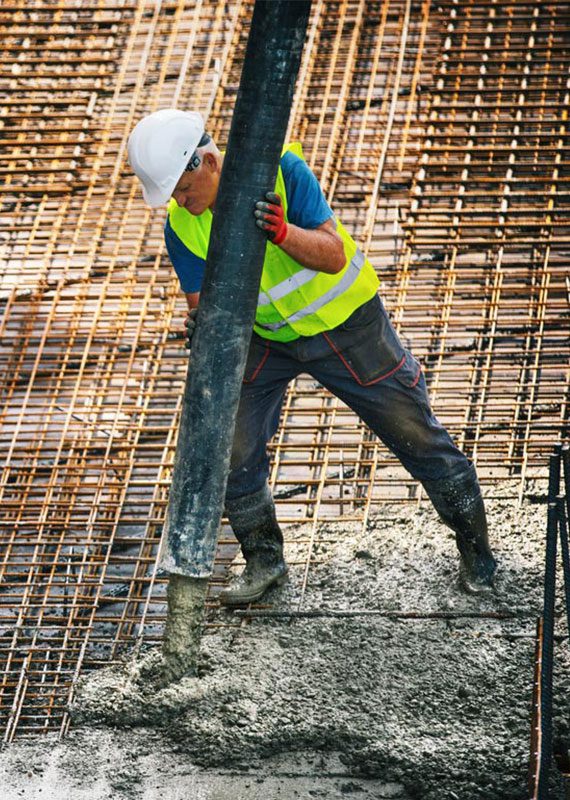 Man pouring concrete