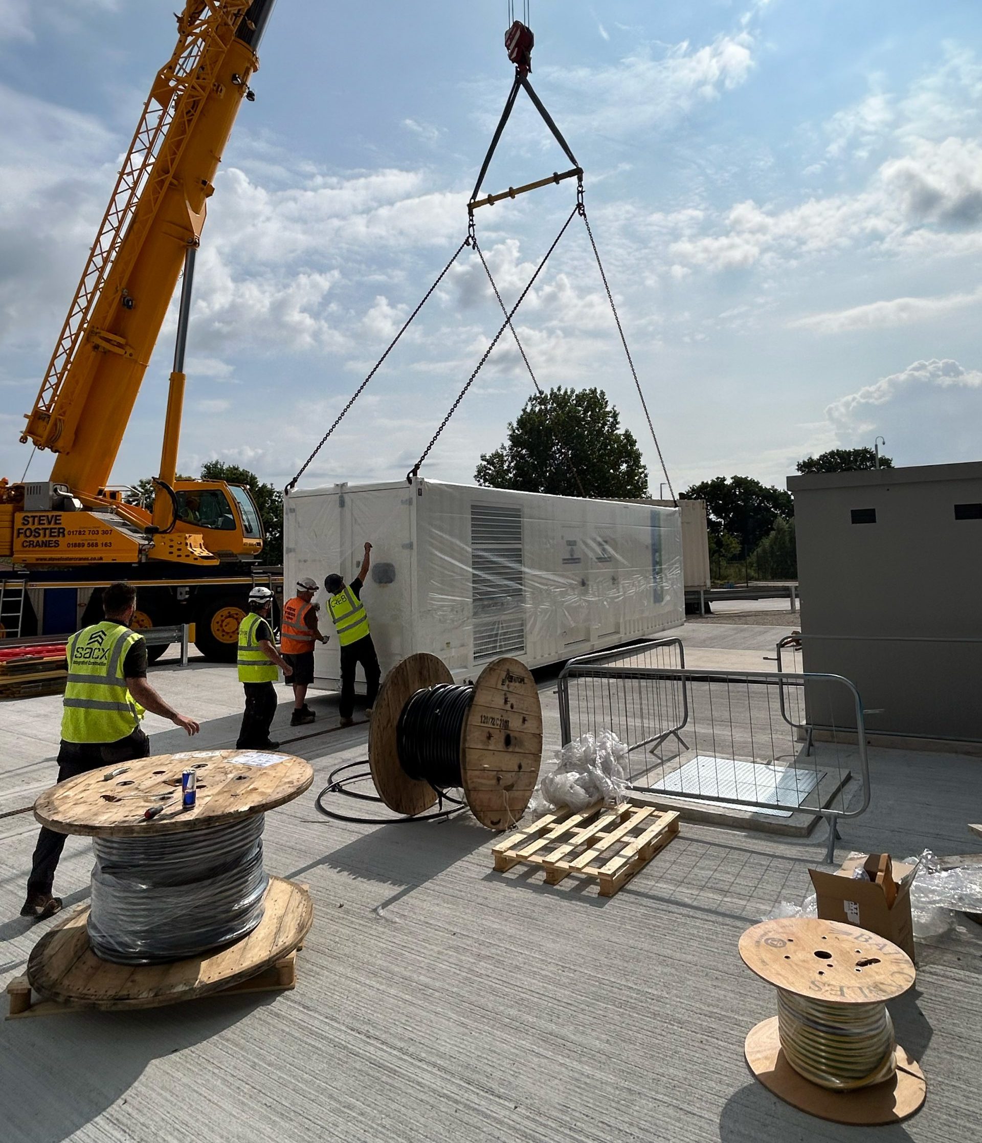 Crane lifting large generator unit