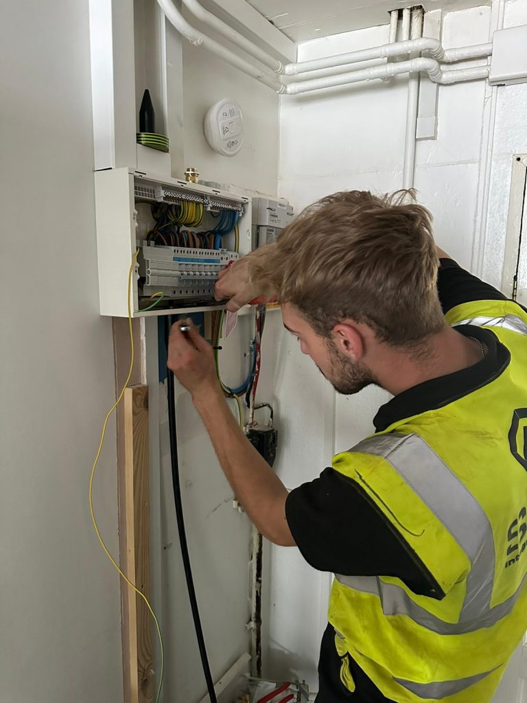 Man servicing fuse box